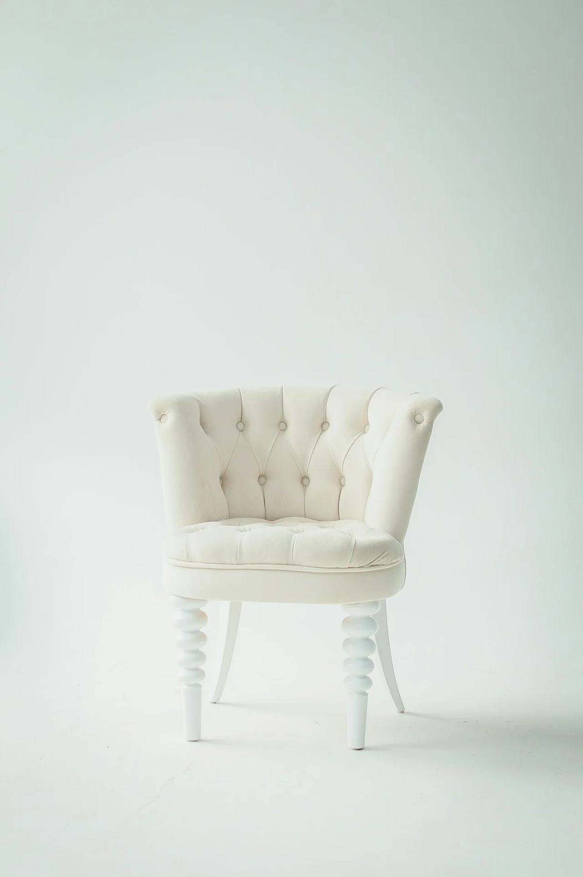 White upholstered accent lounge chair
